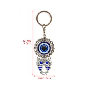 Detail view of Evil Eye owl keychain with dimensions 5 inches in length and 1.57 inches wide