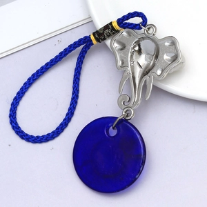 Detailed view of the Evil Eye elephant keychain with blue braided rope and resin charm