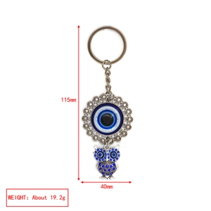 Blue owl keychain with Evil Eye bead and rhinestones showing 115mm length detail