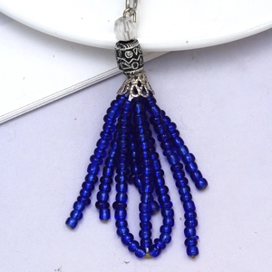 Dark blue beaded tassel keychain with evil eye heart pendant and silver vintage accents