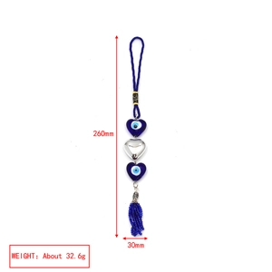 Detail view of Evil Eye heart charm with 260mm length and 30mm width specifications