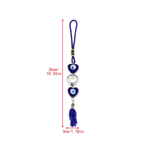 Blue heart Evil Eye pendant charm with woven cord and tassel details, 26cm in length