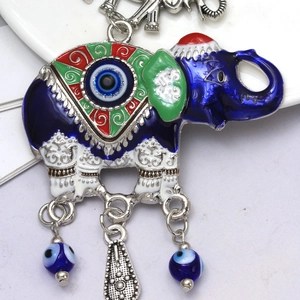 Blue enamel elephant keychain with Evil Eye patterns and ethnic tassel ornament