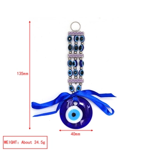 Detail view of Evil Eye charm with 135mm total length and 40mm blue glass disk dimensions