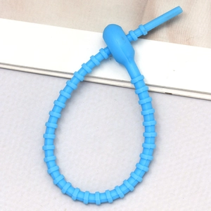 Detailed view of the blue silicone cable tie with adjustable locking head and non-slip teeth