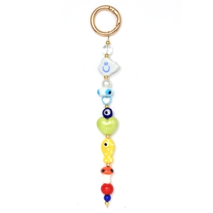 Close-up of colorful beaded keychain with evil eye, mushroom and heart charms