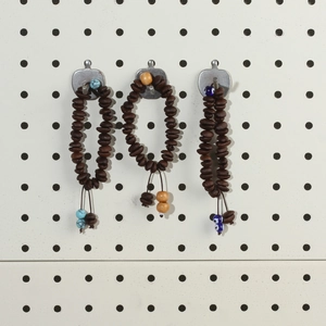Handmade coffee bean bead bracelet with evil eye charms and turquoise wood accents