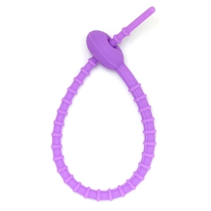 Macro view of adjustable lavender silicone cable tie with matte texture and locking design