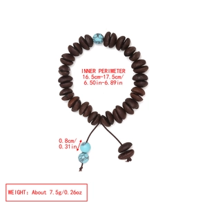 Detail showing coffee bean beads and blue evil eye stones with sizing measurements