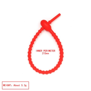 Detailed view of red silicone cable tie bracelet with inner perimeter of 215mm