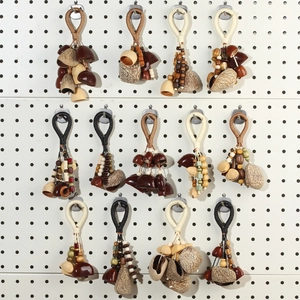 Detailed collection of handmade seed nut shell pendants with ethnic woven rope textures