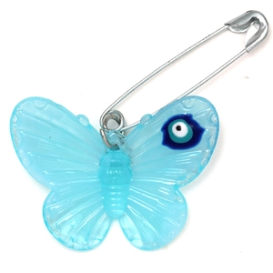 Detailed view of light blue acrylic butterfly pendant with evil eye motif on silver pin