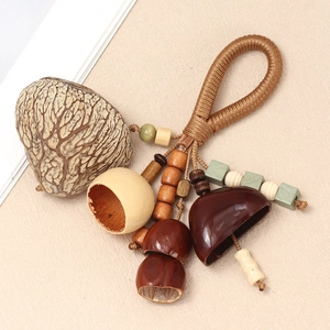 Macro view of natural nut shell pendant with hand-woven rope and ethnic wooden beads