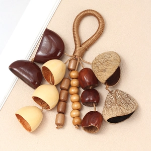 Close-up of natural nut shells and wooden beads on a handcrafted woven ethnic rattle