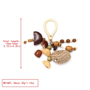 Macro detail of handmade natural nut shell pendant with woven rope and wooden beads