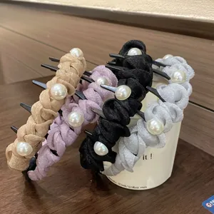 Detail of woven fabric headbands with artificial pearls and non-slip inner teeth