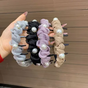 Detailed view of four pleated fabric headbands with large pearls and non-slip inner teeth