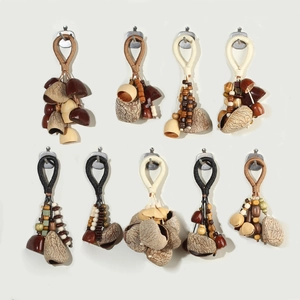 Handmade natural nut shell pendants with ethnic woven rope for bags and keychains