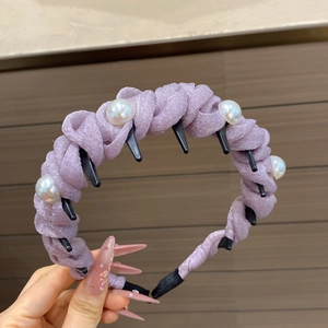 Detail of lavender pleated fabric headband with white pearls and non-slip inner comb