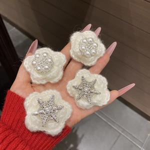 Set of four sweet winter snowflake hair clips with white knit flowers and pearls