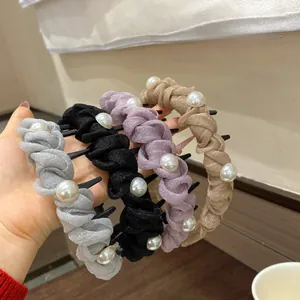 Detail showing woven mesh textures and faux pearls on non-slip hairbands in four colors