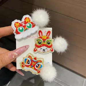 Three-piece Chinese New Year hair clips with lion dance embroidery and white faux fur trim
