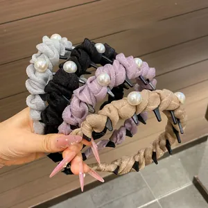 Detail of four-piece pleated headband set with faux pearls and anti-slip teeth feature