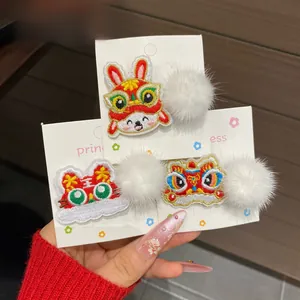 Detailed embroidery of rabbit and lion dance patterns on festive New Year hair clips