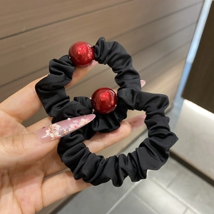 Set of 2 black scrunchies with large red beads for elegant high-elasticity hair styling