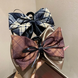 Checkered bow hair claw clip set with elegant ribbons in blue and brown patterns