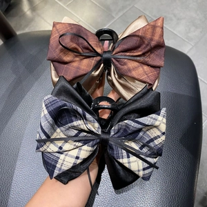 Checkered bow hair claw clip 13cm featuring brown and black ribbon styles for women