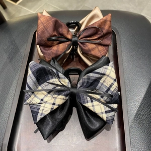 Plaid ribbon bow hair claw clips in brown and black checkered patterns set of two