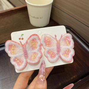 Détails de pinces à cheveux papillon brodées roses avec motifs floraux et pompons