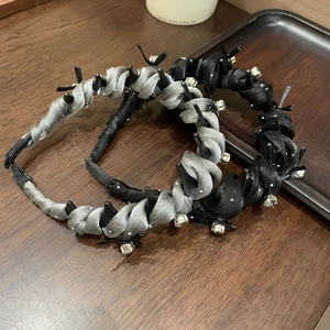 Detail of woven satin headbands with sparkling rhinestones and inner teeth for extra grip