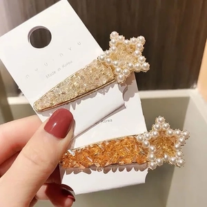 Star shaped hair clips with pearls and crystals in champagne and orange colors