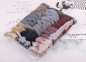 Close-up of seamless elastic hair ties in multi-color knit fabric multipack packaging