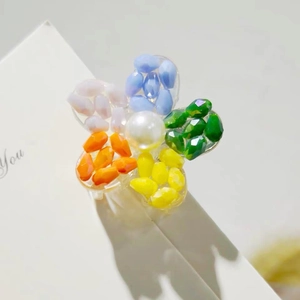 Rainbow crystal flower hair claw clip with colorful resin beads and a pearl center
