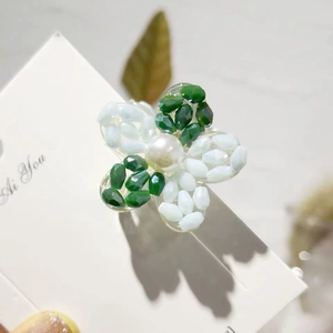 Exquisite beaded flower hair clip with green and white crystals and center pearl