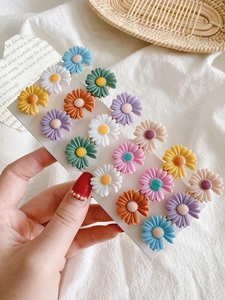 Set of colorful daisy flower hair clips in various matte macaron colors for women