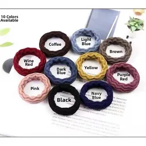 Detailed view of ten colorful high-elastic seamless hair ties with thick ribbed texture