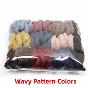 Macro detail of bulk pack colorful wavy high-elastic seamless hair ties in a transparent bag
