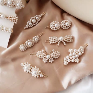 Elegant French vintage pearl hair clip set with butterfly floral motifs on gold metal