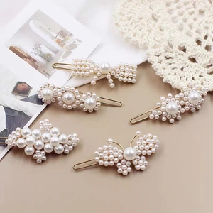 Five-piece French vintage pearl hair clip set with floral and bow designs in gold finish