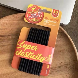 Detail of 10-piece black high-elasticity hair ties in minimalist MSMF packaging