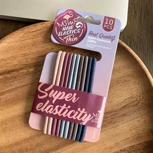 Set of 10 high-elasticity hair ties in assorted colors displayed on a wooden tray