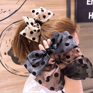 Elegant organza bow hair clip with black flocked polka dots in multiple colors