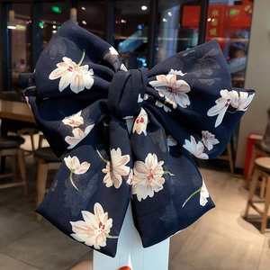 Elegant large navy blue floral chiffon bow hair clip for women on display card