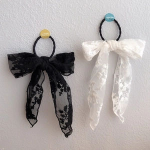Elegant pair of black and white lace bow hair clips with long embroidered floral ribbons