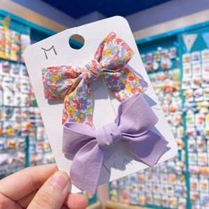 Lot de deux barrettes à cheveux avec nœuds à carreaux et fleurs violettes pour filles
