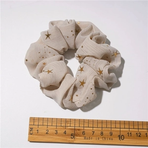 Beige chiffon scrunchie with gold star pattern showing 10.5cm diameter measurement